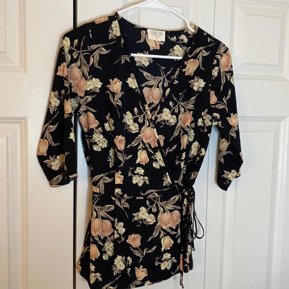 Women’s floral peplum blouse with side tie detail